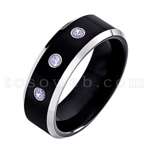 May include: A black tungsten carbide ring with a silver band and three small purple gemstones.