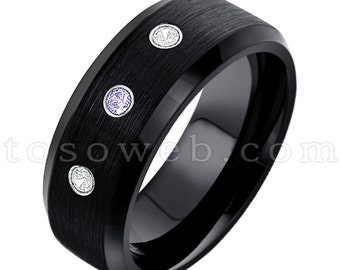 May include: A black tungsten carbide ring with a brushed finish and three gemstones. The ring has two clear gemstones and one purple gemstone.