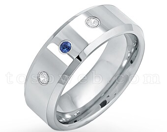 May include: A silver wedding band with three gemstones. The band has a beveled edge and a polished finish. The gemstones are a blue sapphire and two white diamonds.