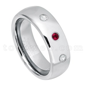 May include: A silver tungsten carbide ring with three stones set into the band. The stones are a red ruby and two clear diamonds.
