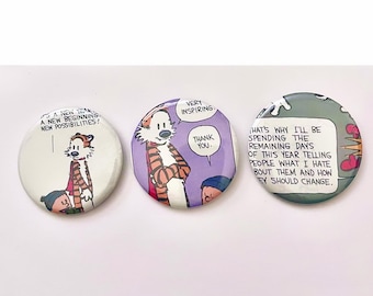 May include: Three circular badges with Calvin and Hobbes comic strip illustrations. One badge displays the text "A New Beginning. New Possibilities!". Another says "Very Inspiring. Thank You.". The third has a quote about telling people what you hate.