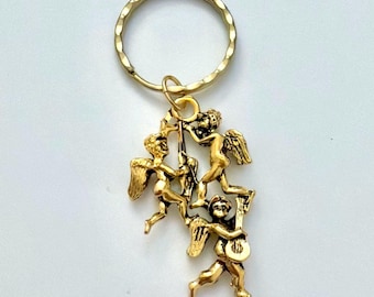 Vintage Kirks Folly gold-tone angel trio musical keyring