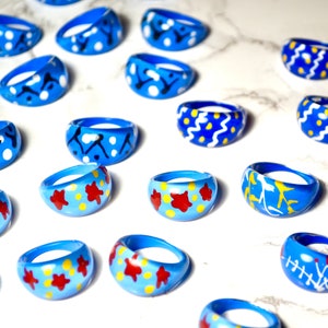 Vintage NOS Lucite Plastic Blue Patterned Rings