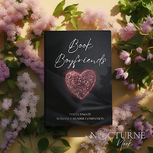 May include: A black book with the title "Book Boyfriends: The Ultimate Romance Reader Companion" and a pink glitter heart on the cover. The book is surrounded by pink flowers.