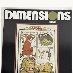 May include: A Dimensions crewel embroidery kit package featuring Aesop's Fables. The cover displays illustrations of a fox, a hare and tortoise, a town mouse and country mouse, and a lion and mouse, all framed within a decorative border.