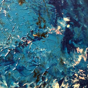May include: Abstract painting with blue, white, and black paint. The paint is applied in thick layers, creating a textured surface. The colors are blended together to create a swirling effect.