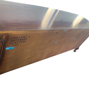 May include: The back of a wooden cabinet with a label that reads "206-140 | Brittany Heritage 685".