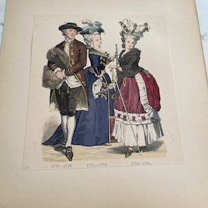 May include: An antique print depicting three people in 18th-century clothing. The man is wearing a brown coat with a fur collar, a white shirt, and a black hat. The two women are wearing elaborate dresses with large, ornate hats. The print is dated 1778-1779, 1774-1779, and 1778-1780.