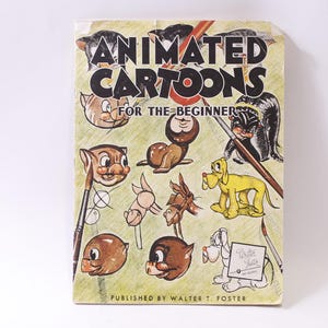 May include: Vintage book cover titled "Animated Cartoons for the Beginner." The cover features cartoon illustrations of various animals, including cats, dogs, and a seal. The book is published by Walter T. Foster.