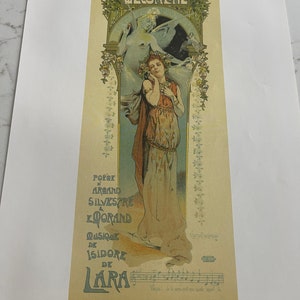 May include: A vintage poster advertising the opera "Messaline" featuring a woman in a white dress and a crown of flowers. The poster includes the names "Poix d'Arand Silvestre & Lorand" and "Musique de Isidore de Lara".