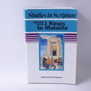 May include: A white book titled "Studies in Scripture" with a blue and purple striped cover. The book is volume four and covers 1 Kings to Malachi. The cover features an illustration of a temple with people in front of it.