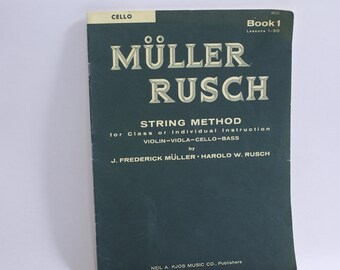 May include: A green book titled "MÜLLER RUSCH STRING METHOD for Class or Individual Instruction VIOLIN-VIOLA-CELLO-BASS by J. FREDERICK MÜLLER HAROLD W. RUSCH" with the words "CELLO Book 1 Lessons 1-30" at the top.