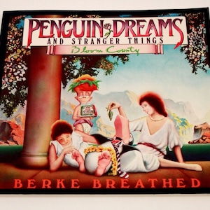 Pode incluir: Uma capa de álbum vintage com uma ilustração colorida de três pessoas em um cenário fantástico. O título do álbum é "Penguin Dreams and Stranger Things Bloom County" de "Berke Breathed".