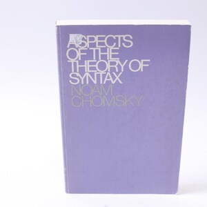 May include: A purple book with the title "Aspects of the Theory of Syntax" by Noam Chomsky.