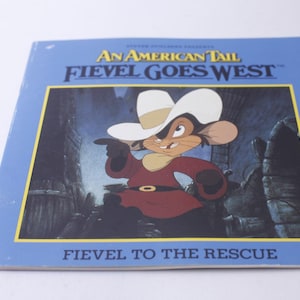 May include: A blue book cover with the title "An American Tail: Fievel Goes West" and a picture of Fievel Mousekewitz wearing a cowboy hat and red shirt. The text "Fievel to the Rescue" is at the bottom of the cover.