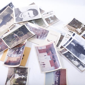 May include: A collection of vintage black and white photographs, some with a sepia tone, featuring various subjects including portraits, landscapes, and a group of people. The photos are arranged in a random order on a white surface.