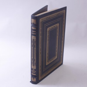 May include: A dark blue hardback book with gold lettering on the spine that reads "Danton's Death" and "The Modern Library".