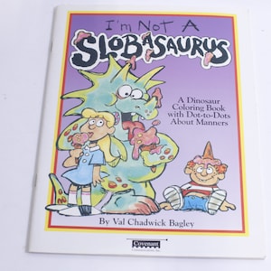 May include: A coloring book featuring a green dinosaur with a purple background. The book title is "I'm Not A Slobasaurs" and the text says "A Dinosaur Coloring Book with Dot-to-Dots About Manners".