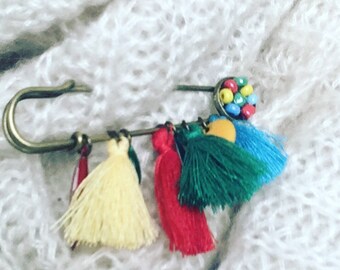 Multicolored hand brooch