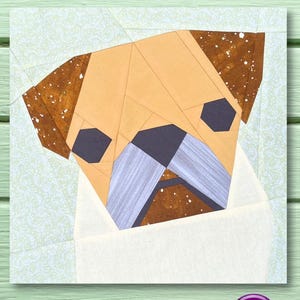 May include: A paper pieced pug dog pattern with brown, beige, white, and gray fabric pieces. The pug is looking directly at the viewer.