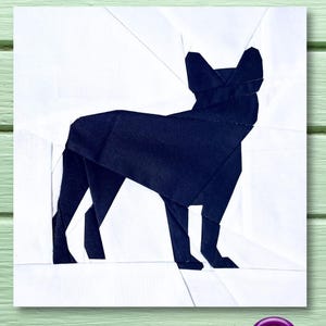 May include: A black silhouette of a French bulldog on a white background. The silhouette is made of paper and is a paper craft project.