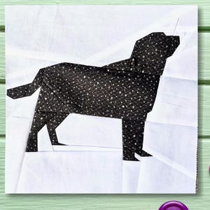 May include: Black and white fabric applique of a dog silhouette. The dog is standing on a white background. The fabric has a small white polka dot pattern.