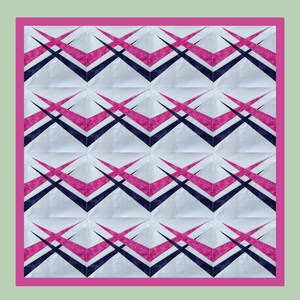 May include: A square quilt with a repeating geometric pattern. The design features white squares with intersecting pink and navy blue shapes. A bright pink border frames the quilt, set against a pale green background.