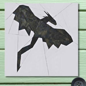 May include: A set of three ceramic mugs with a speckled, matte finish. The mugs are in shades of cream, light grey, and dark grey. Each mug has a simple, minimalist design and a rounded handle.