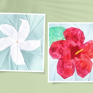 May include: Two paper pieced flower blocks, one white and one red. The white flower is on a light blue background and the red flower is on a light blue background with a green leaf.