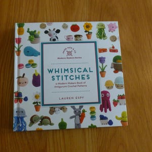 May include: A set of three ceramic mugs with a speckled, matte finish. The mugs are in shades of cream, light brown, and dark brown. Each mug has a simple, minimalist design, perfect for coffee or tea.