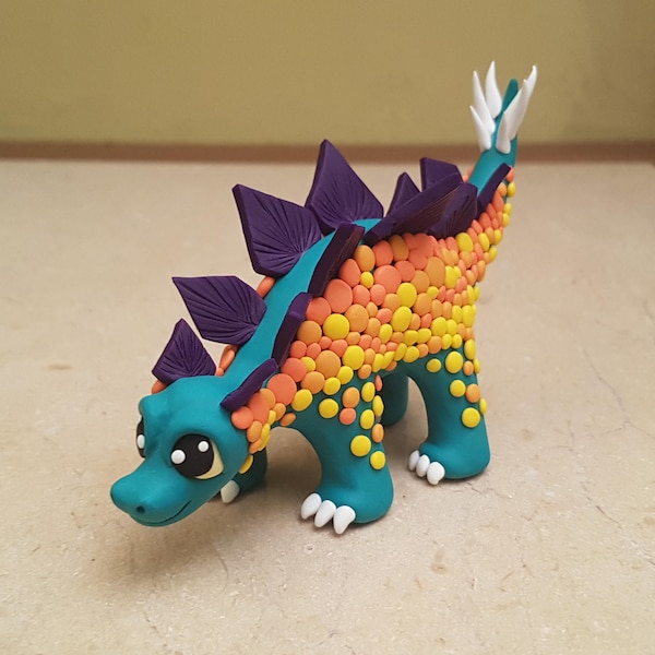 dinosaur stegosaurus sculpture, handmade dino figurine, polymer clay prehistoric creature, colorful dinosaur statue, miniature stegosaurus