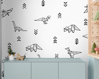May include: A light blue dresser with two doors and a white wall with black origami dinosaur and geometric shapes decals.
