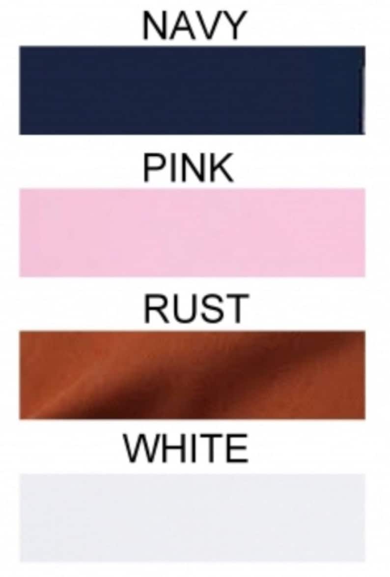 May include: Four fabric swatches in different colors: navy blue, pink, rust, and white.