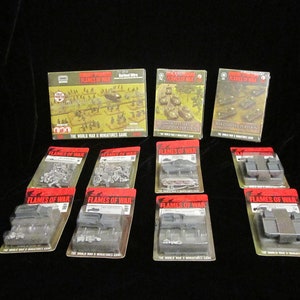 Flames of war vintage lot unopened. Stuart platoon, firefly trucks, barbed wire 25 pounder etc.