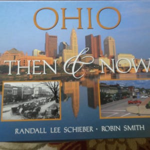 May include: A hardcover book titled "OHIO Then & Now" with a cityscape image and two historical photos. The cover features the title in gold and white script, with the authors' names at the bottom.