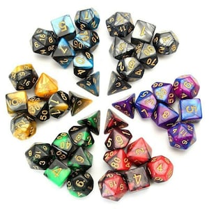 May include: A set of 20 polyhedral dice in various colors and patterns, including black, gold, red, green, blue, purple, and silver. The dice are arranged in a circle on a white background.