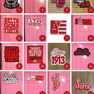 May include: A selection of embroidered patches with diverse designs. The patches display text such as "DIVA!", "Delta Sigma Theta", and "Soror", alongside Greek letters and other graphics. The patches are in red, black, and white.