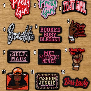 May include: A collection of twelve embroidered patches featuring various designs and text including Pretty Girl, That Girl, Baddie, Booked Busy Blessed, Pretty Girls Smell Expensive, Self Made, Me? Sarcastic? Never, Clock That Tea, Fashion Junkie, and Boss Lady.
