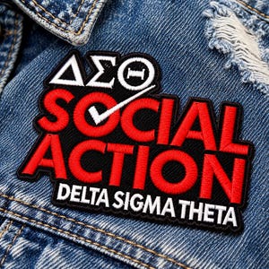 May include: An embroidered patch on a blue denim jacket featuring the Greek letters Delta Sigma Theta in white, the words SOCIAL ACTION in red with a white checkmark, and the text DELTA SIGMA THETA in white on a black background.