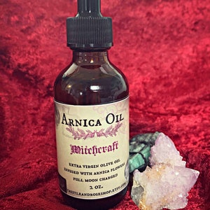 Arnica Oil, herbal oils,  natural infused oils, herbalism, witchcraft oil, arnica flowers,