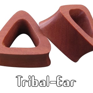 May include: Two reddish-brown, triangle-shaped ear gauges. The gauges have a smooth texture and a hollow center. The text "Tribal-Ear" is written in a stylized font below the gauges.