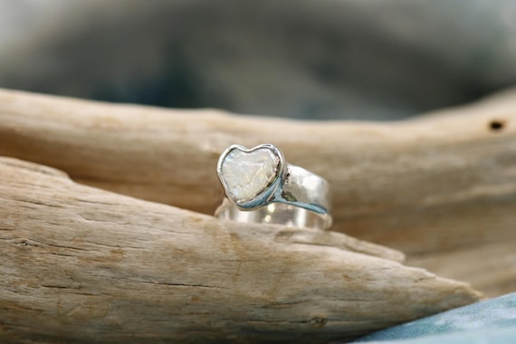Sterling silver ring, with bezel set mother of pearl heart.