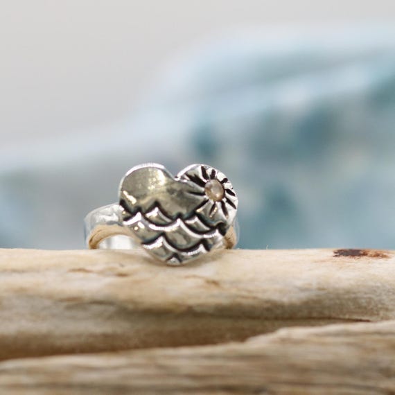 sterling silver ring, heart shaped, embossed waves, sun, with yellow topaz cz