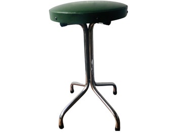 tabouret vintage en métal avec revêtement en simili cuir vert, en bon état !