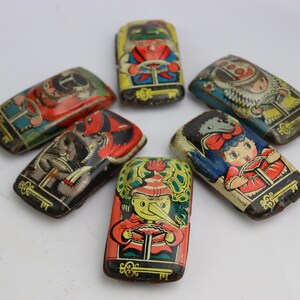 vintage collection of 6 tin racing cars with Soviet cartoon characters, Buratino, Karabas Barabas, Malvina, poodle dog Artemon, Papa Carlo
