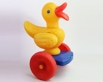 Large bright cute plastic duck on wheels. vintage toy duckling. Soviet Toy. Vintage Toy. Soviet goose doll. christmas gift. gift idea