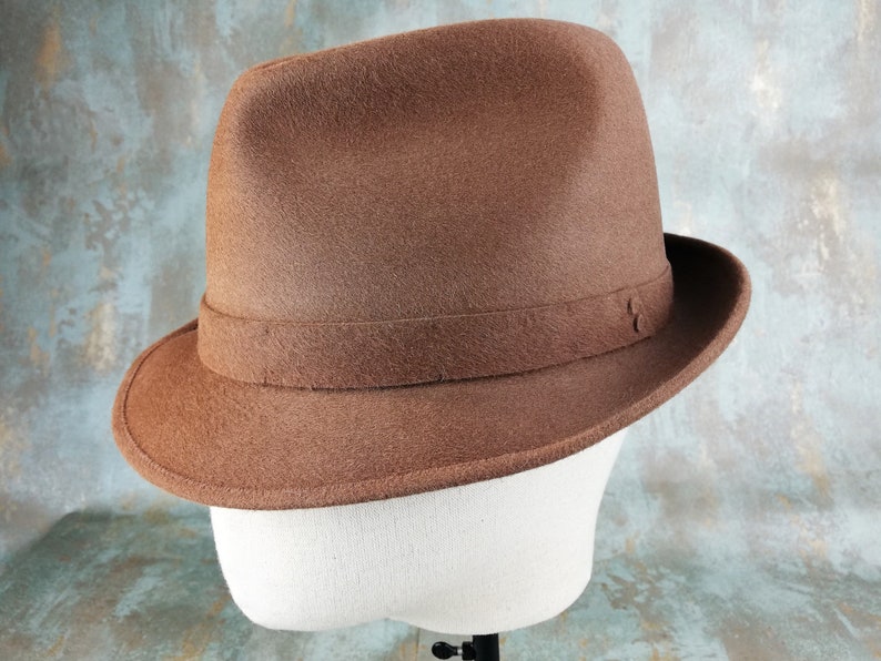 the brown felt hat