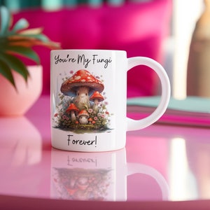May include: White ceramic mug with a cute illustration of mushrooms and the text "You're My Fungi Forever!"