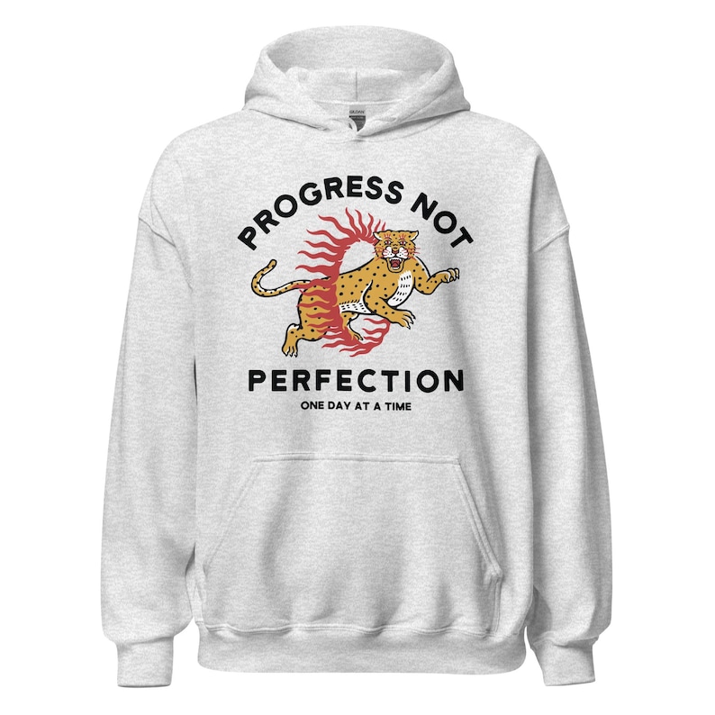 ash Hoodie with the phrase "Progress Not Perfection," a popular recovery and 12 step slogan used in AA and NA.