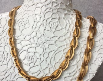 Three Piece Trifari gold toned set.